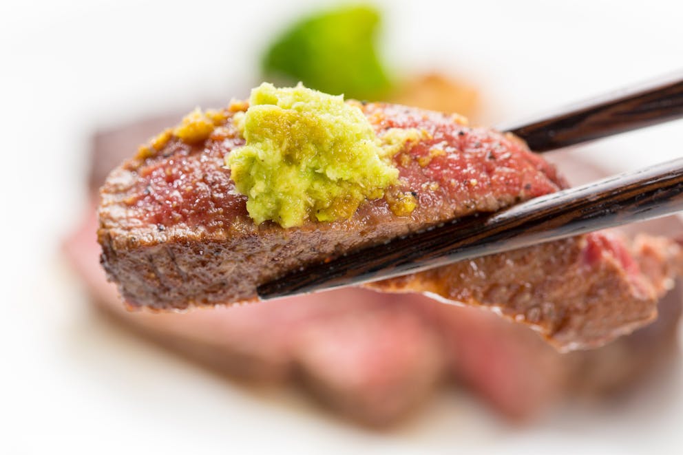 Freshly grated wasabi on steak
