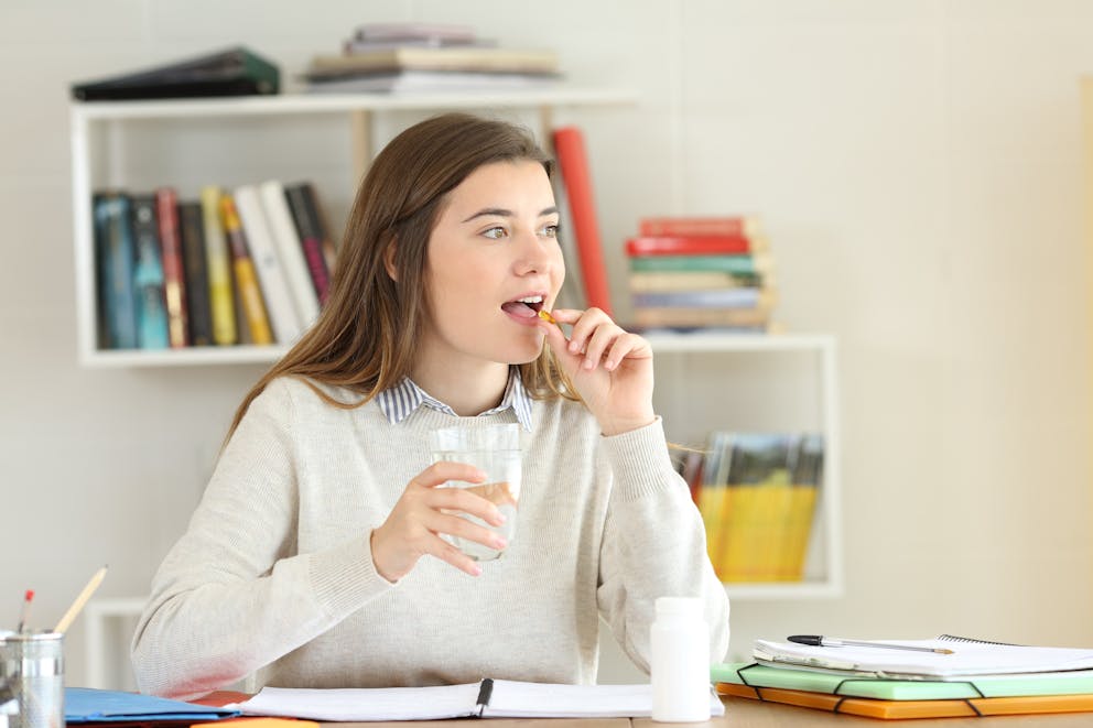 Student taking vitamin D