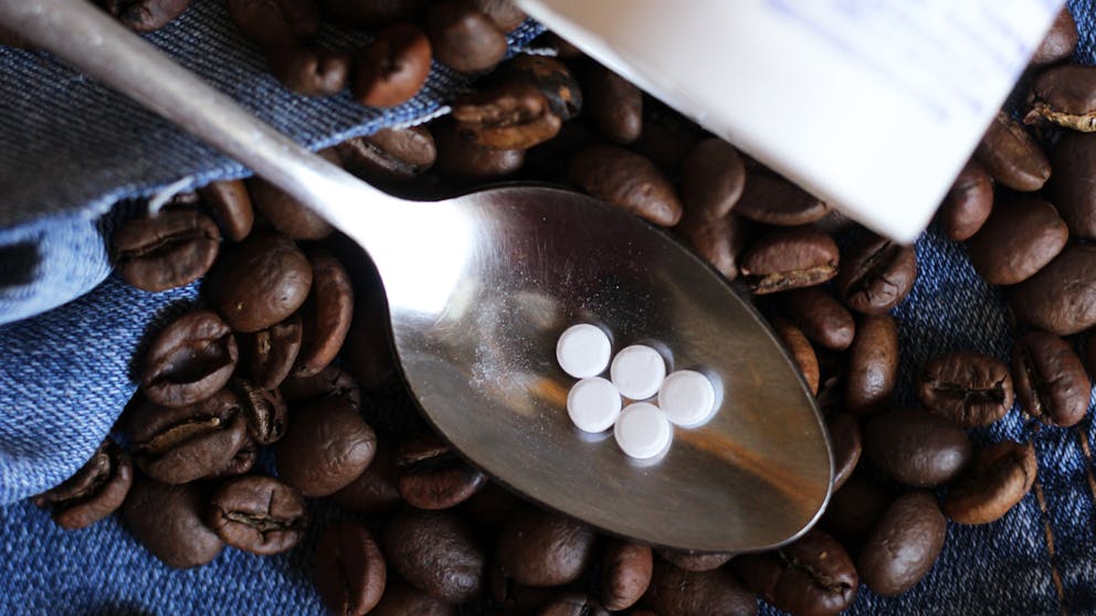 Splenda tablets on coffee beans