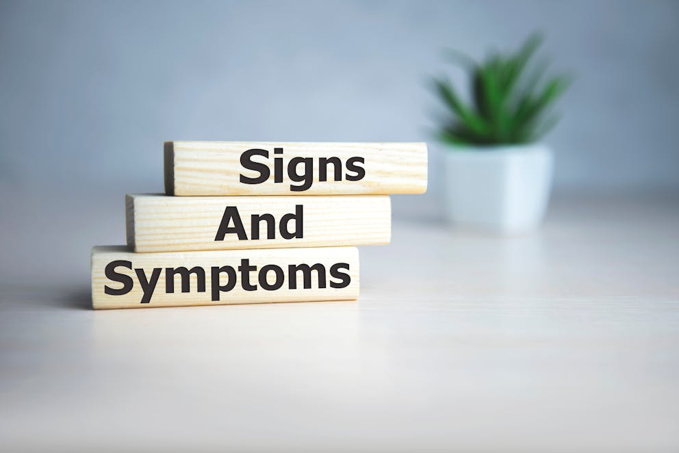 Signs and symptoms written on wood blocks