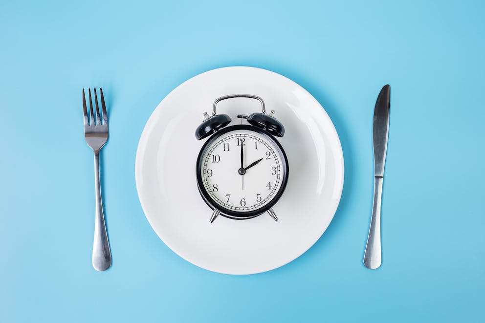 Alarm clock on a white plate