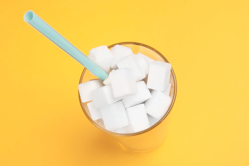 Drinking glass full of sugar