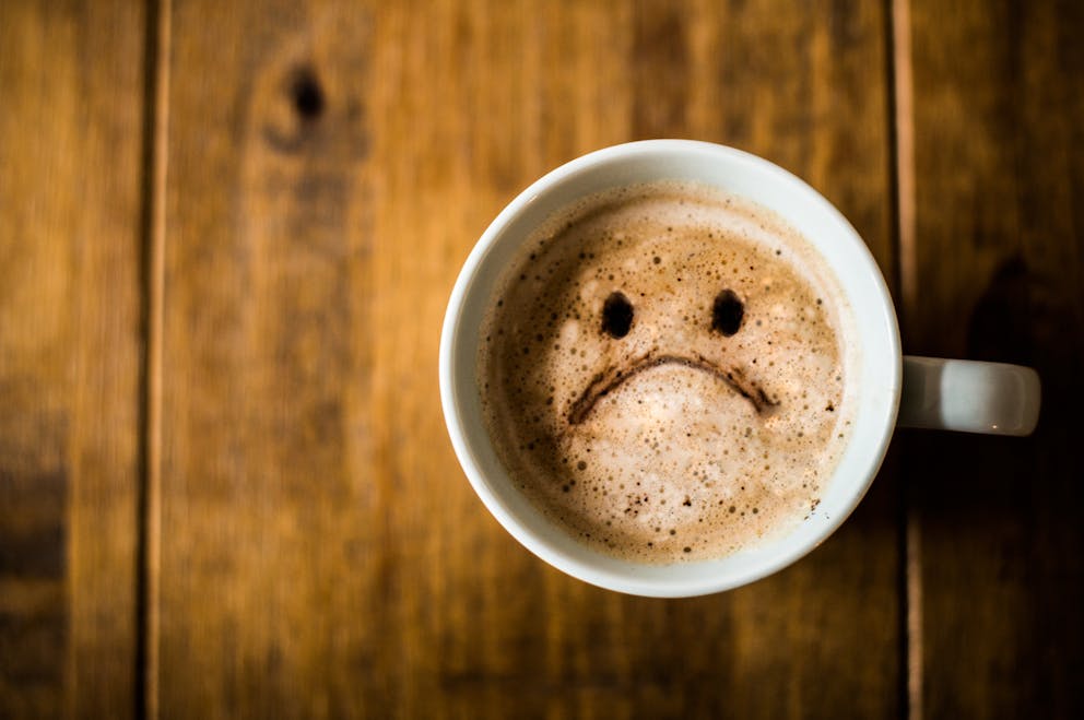 Sad face in coffee
