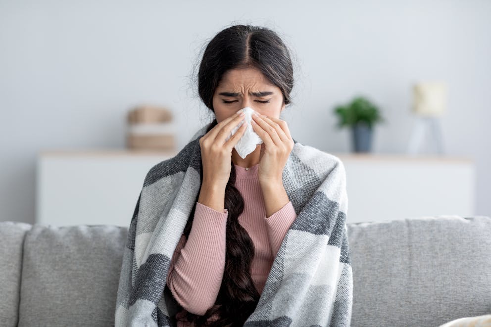 Woman with flu symptoms