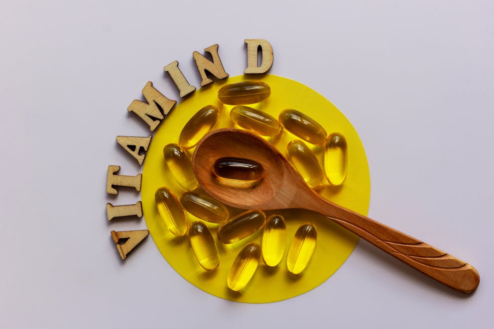 vitamin D pill with a spoon