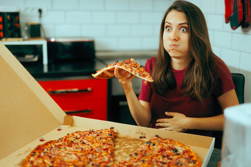 woman feeling sick eating carbs