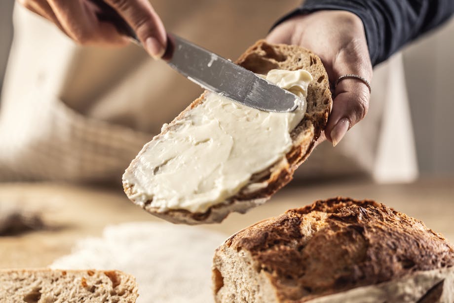 Spreading cream to bread