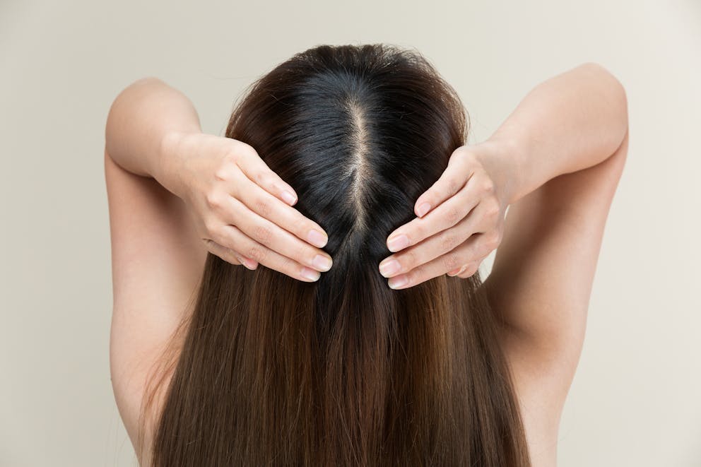 Woman massaging scalp