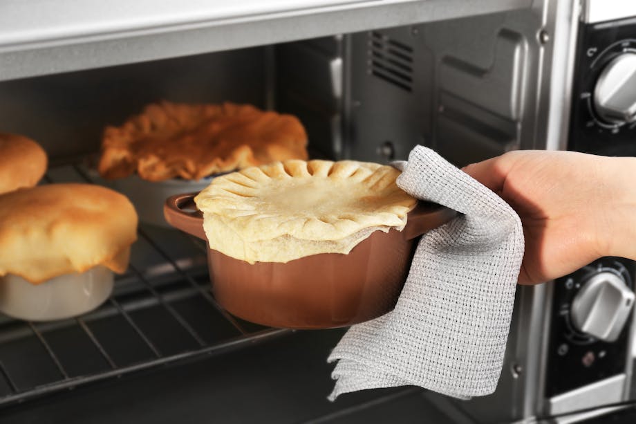 Placing pot pie in the oven