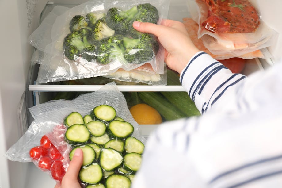 Placing vegetables in the fridge