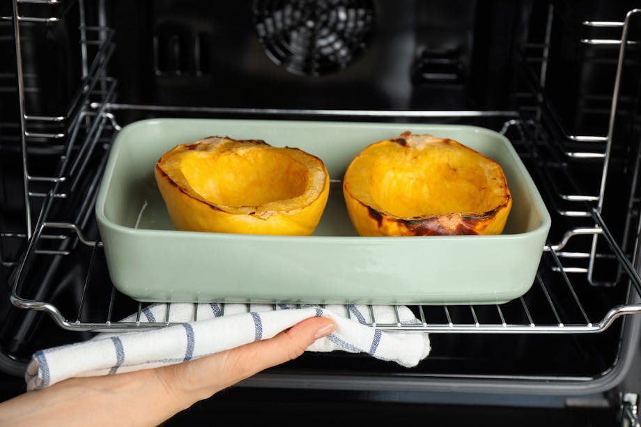 Placing spaghetti squash in the oven