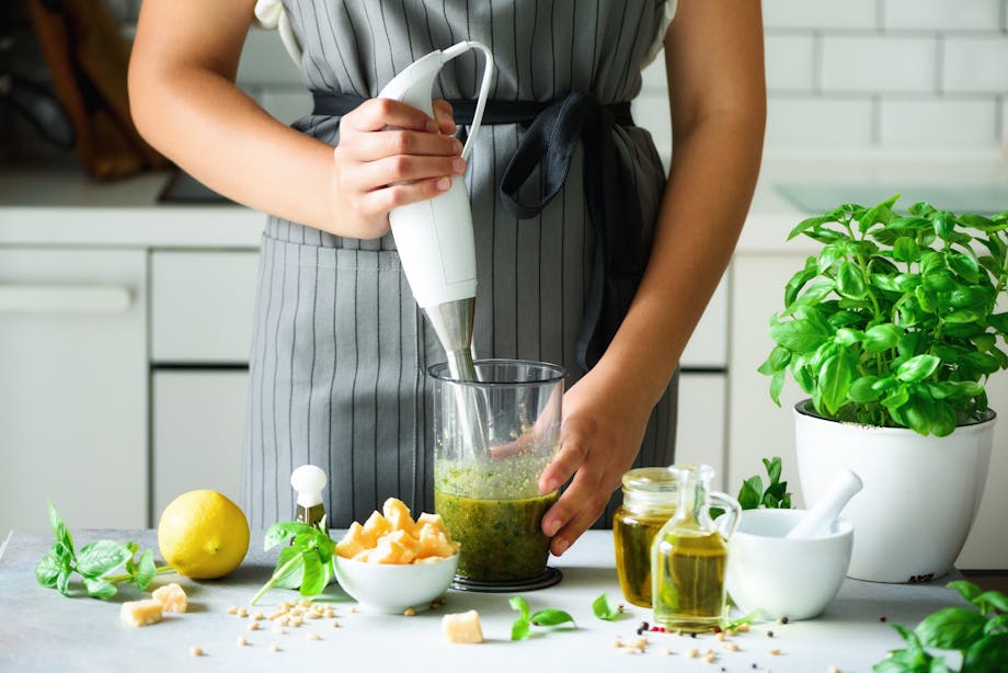 Woman making pesto