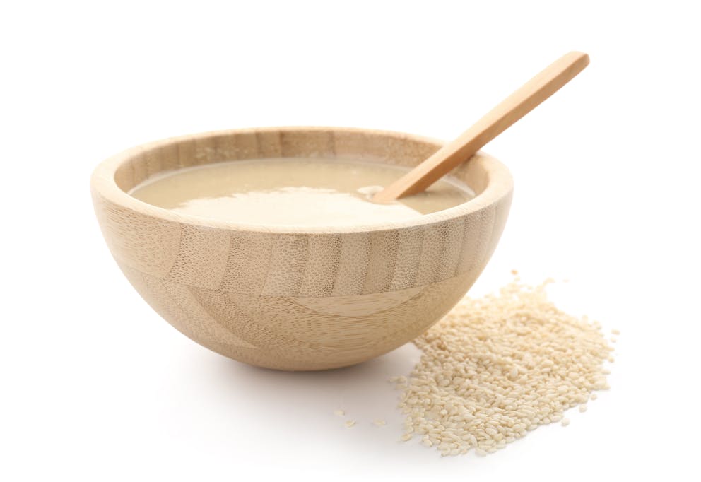 Tahini in a wooden bowl