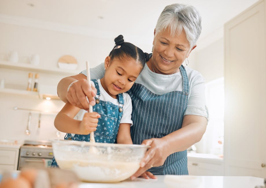 Grandmother and grandchild baking