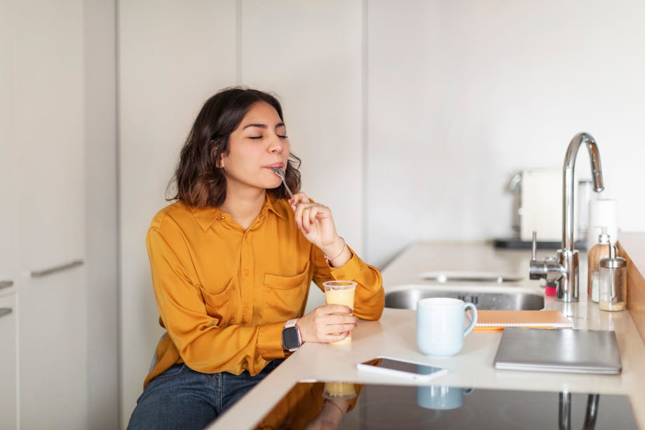 Woman eating pudding