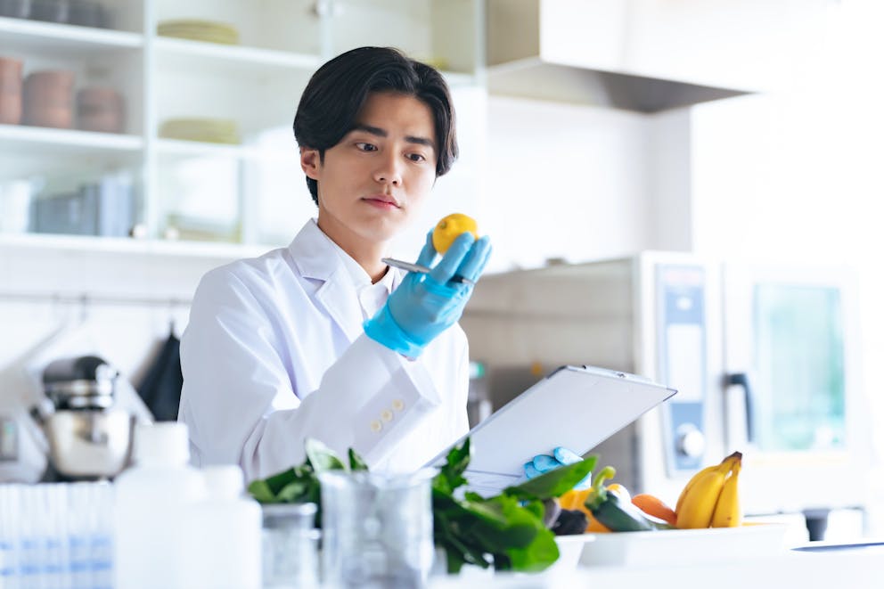 Scientist analyzing a lemon