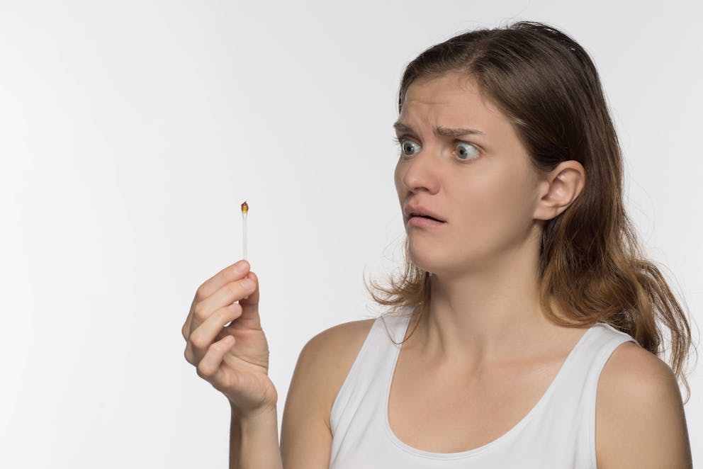 Young woman with ear wax