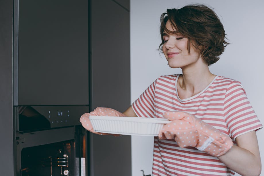 Putting casserole in oven