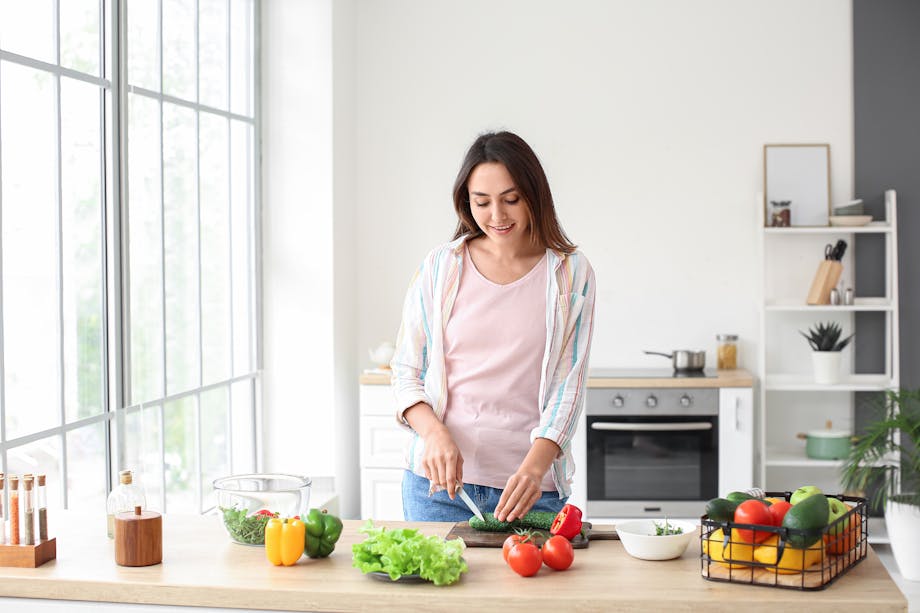 Woman making salad