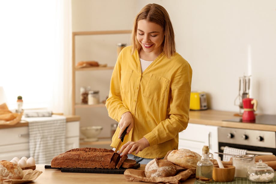 Woman cutting bread