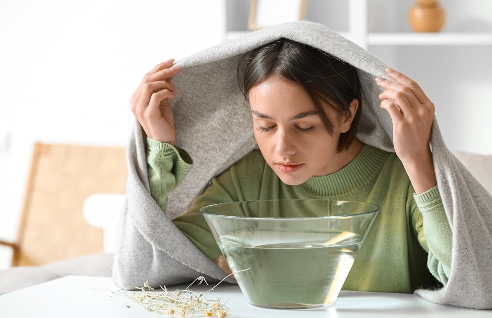 Woman doing steam inhalation