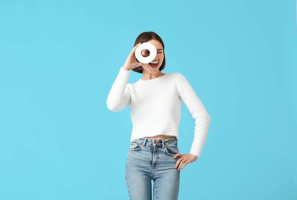 Woman holding toilet paper